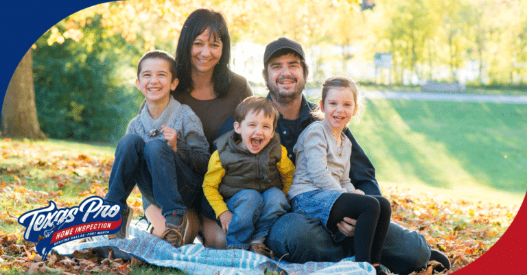 Happy family sitting outdoors on a fall day