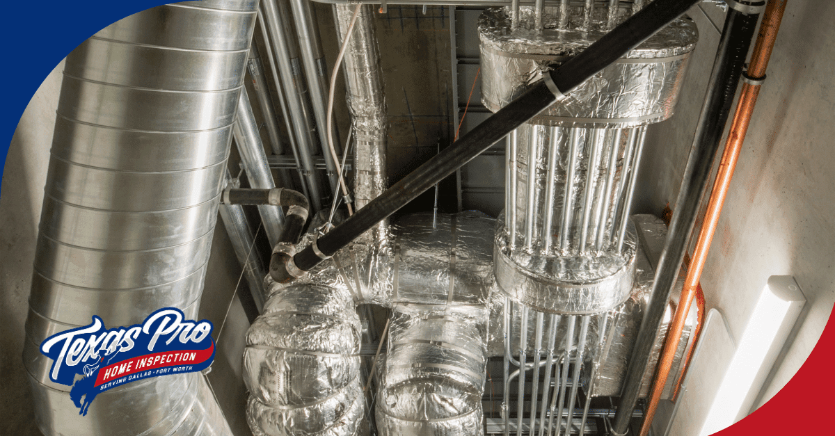 Close-up of air ducts and piping systems in a commercial building.