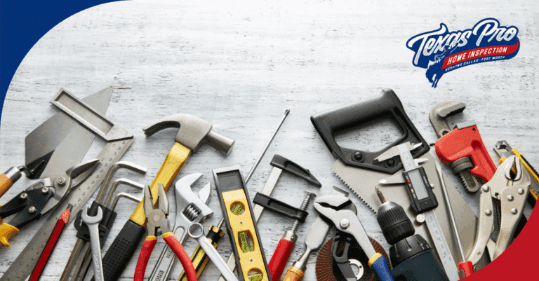 A wide variety of home inspection tools spread out on a light wooden surface.