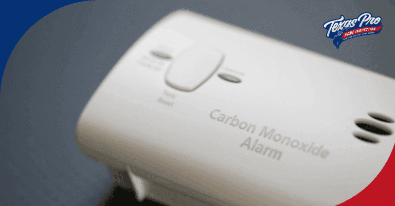 Close-up of a carbon monoxide alarm with test/reset button.
