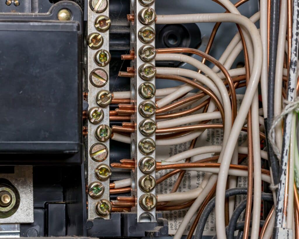Close-up of electrical panel bus bar and copper wiring connections inspected during a Fort Worth home inspection